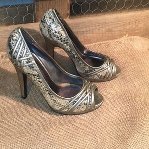 Snake skin peek toe stilettos